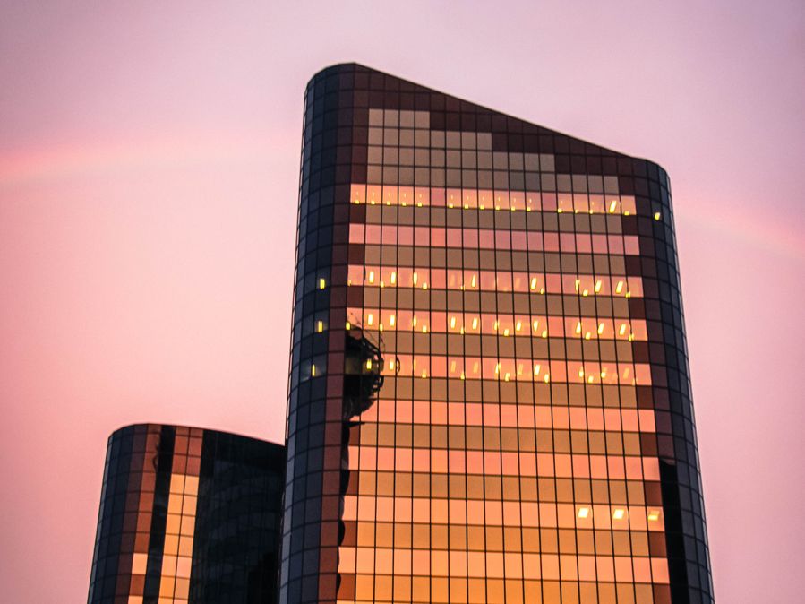 A stunning rainbow emerges, creating a captivating contrast with the architectural beauty of the building. A stunning rainbow emerges, creating a captivating contrast with the architectural beauty of the building.